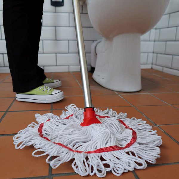 Red Trinity Hygiene mop in use